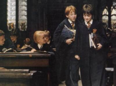 Malfoy looking at Harry and Ron